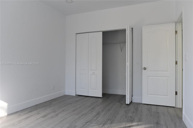 2925 SW 133rd Ave, Miramar, FL 33027 - unfurnished bedroom with wood finished floors and a closet