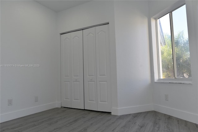 2925 SW 133rd Ave, Miramar, FL 33027 - unfurnished bedroom featuring wood finished floors and a closet