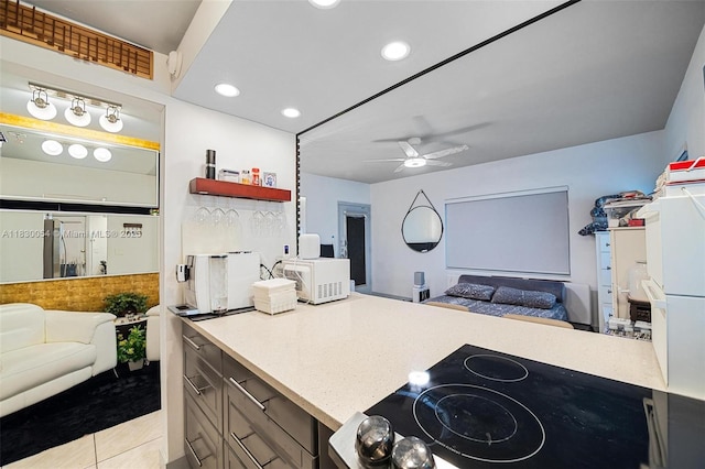 1060 Pennsylvania Ave Unit 7, Miami Beach, FL 33139 - kitchen featuring open floor plan, white microwave, ceiling fan, recessed lighting, and light countertops