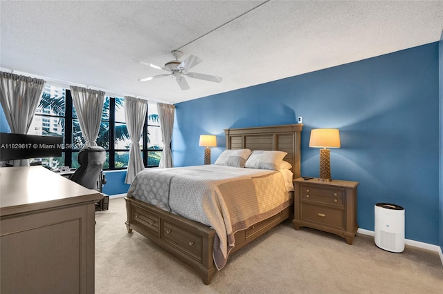 500 Three Islands Blvd Unit 320, Hallandale Beach, FL 33009 - bedroom with light colored carpet, a textured ceiling, ceiling fan, and a desk