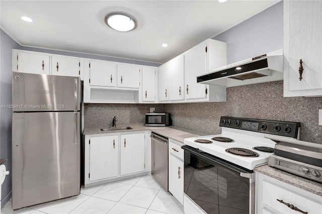 500 Three Islands Blvd Unit 320, Hallandale Beach, FL 33009 - kitchen featuring stainless steel appliances, light countertops, tasteful backsplash, and white cabinets