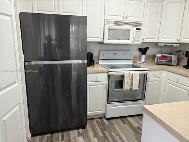 4506 SW 160th Ave Unit 1118, Miramar, FL 33027 - kitchen featuring white appliances, wood finished floors, white cabinetry, and light countertops