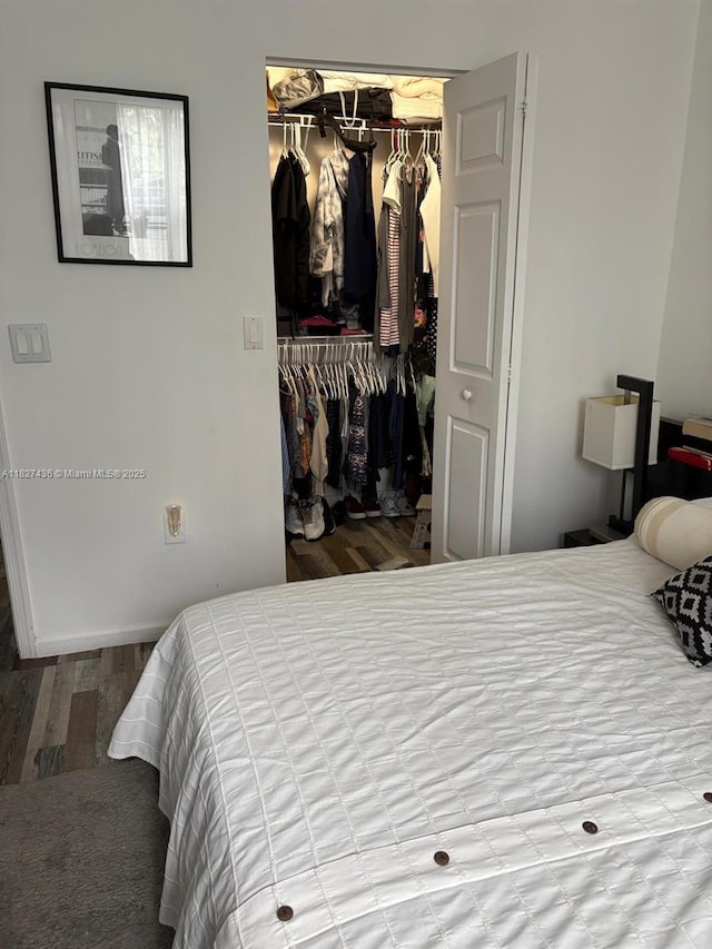 4506 SW 160th Ave Unit 1118, Miramar, FL 33027 - bedroom featuring a closet, wood finished floors, and a spacious closet