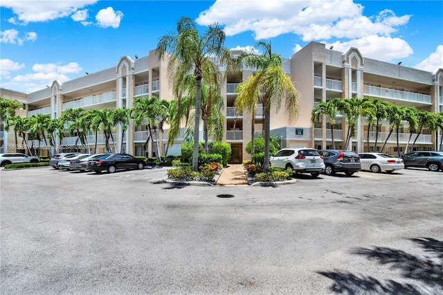 10217 NW 24th Pl Unit 310, Sunrise, FL 33322 - view of apartment building / complex with uncovered parking
