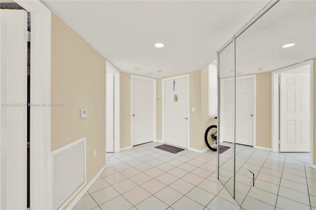 10217 NW 24th Pl Unit 310, Sunrise, FL 33322 - foyer entrance featuring recessed lighting and light tile patterned floors