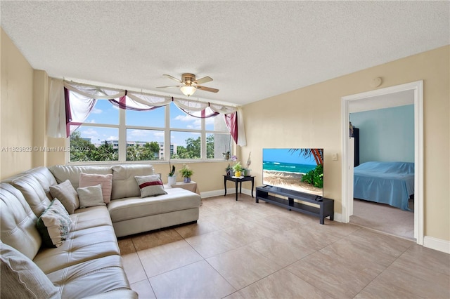 10217 NW 24th Pl Unit 310, Sunrise, FL 33322 - living room featuring ceiling fan, a textured ceiling, and light tile patterned flooring