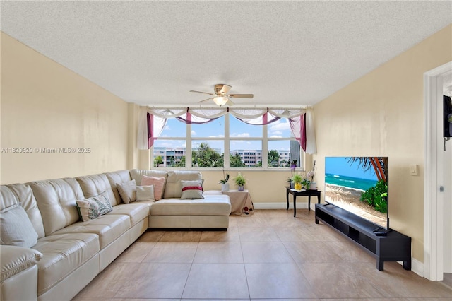 10217 NW 24th Pl Unit 310, Sunrise, FL 33322 - living room featuring a ceiling fan, a textured ceiling, and light tile patterned flooring