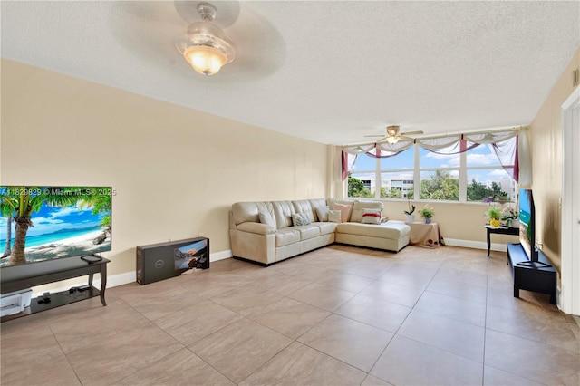 10217 NW 24th Pl Unit 310, Sunrise, FL 33322 - living area featuring ceiling fan, a textured ceiling, and light tile patterned floors