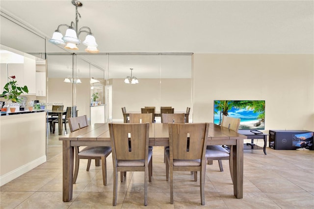 10217 NW 24th Pl Unit 310, Sunrise, FL 33322 - dining area with a chandelier and light tile patterned flooring
