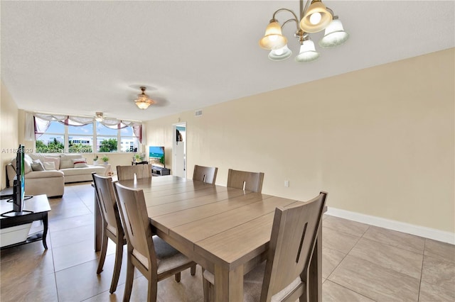 10217 NW 24th Pl Unit 310, Sunrise, FL 33322 - dining room with a chandelier and light tile patterned floors