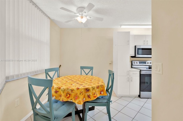 10217 NW 24th Pl Unit 310, Sunrise, FL 33322 - dining area with a ceiling fan, a textured ceiling, and light tile patterned flooring