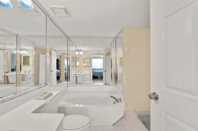 10217 NW 24th Pl Unit 310, Sunrise, FL 33322 - full bath featuring ensuite bathroom, tile patterned floors, a bath, and vanity
