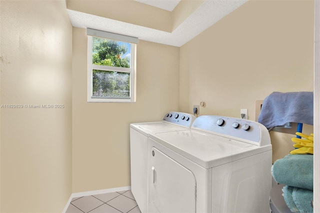 10217 NW 24th Pl Unit 310, Sunrise, FL 33322 - laundry room featuring washer and clothes dryer and light tile patterned floors