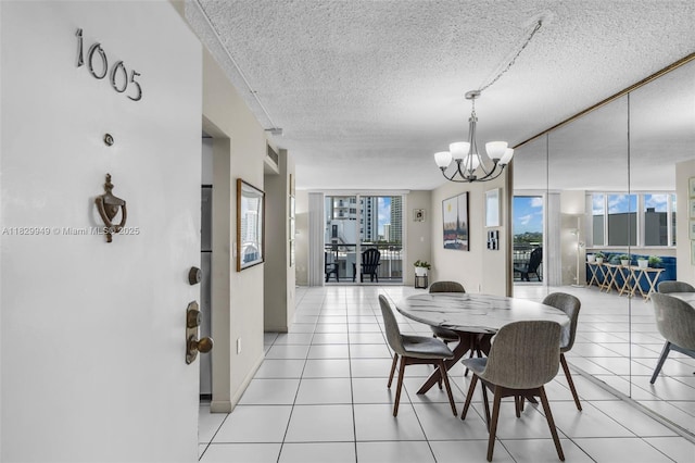 1345 Lincoln Rd Unit 1005, Miami Beach, FL 33139 - dining space with plenty of natural light, a textured ceiling, a chandelier, and light tile patterned floors