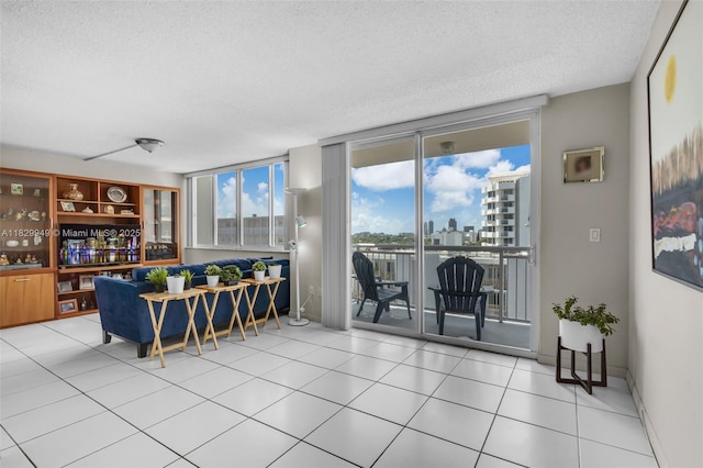 1345 Lincoln Rd Unit 1005, Miami Beach, FL 33139 - living area featuring a textured ceiling, light tile patterned floors, and a city view