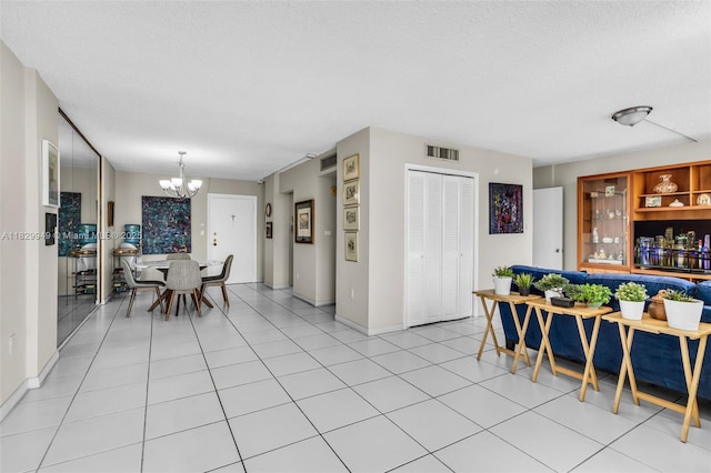1345 Lincoln Rd Unit 1005, Miami Beach, FL 33139 - dining space with a chandelier and a textured ceiling