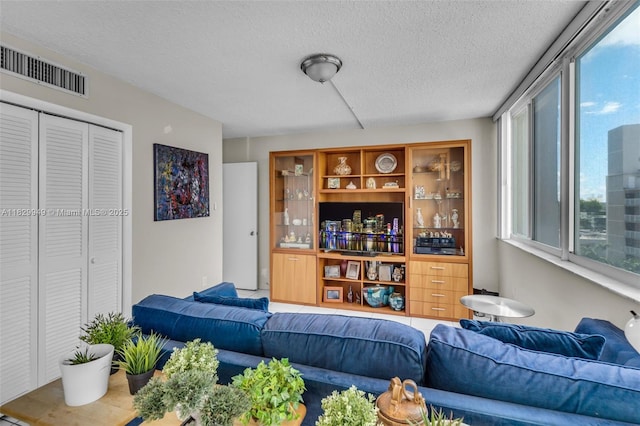 1345 Lincoln Rd Unit 1005, Miami Beach, FL 33139 - living room featuring a textured ceiling