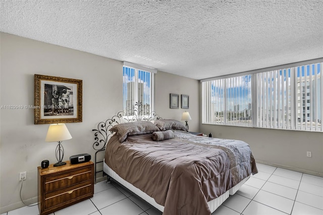 1345 Lincoln Rd Unit 1005, Miami Beach, FL 33139 - bedroom featuring tile patterned floors, multiple windows, and a textured ceiling