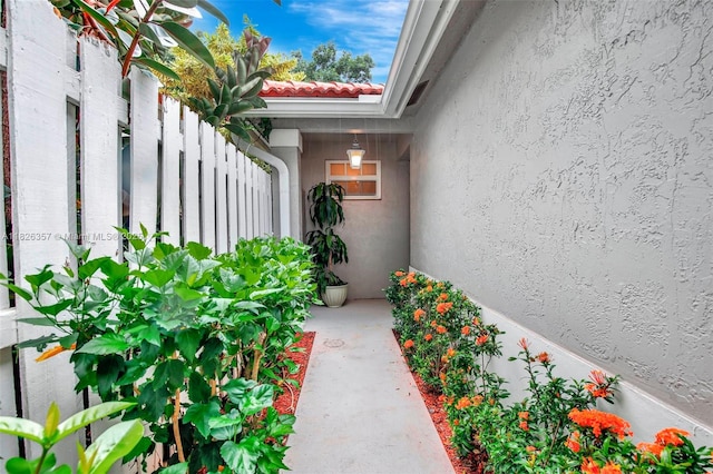 13552 NW 5th Ct, Plantation, FL 33325 - view of exterior entry featuring stucco siding and a tile roof