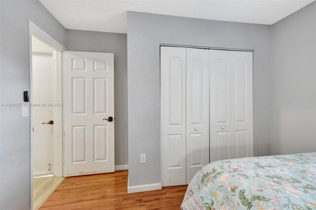 13552 NW 5th Ct, Plantation, FL 33325 - bedroom with a closet and light wood-style flooring