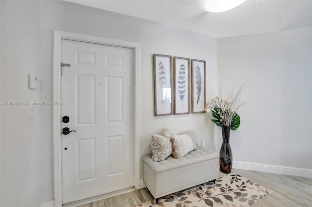 13552 NW 5th Ct, Plantation, FL 33325 - entrance foyer featuring light wood-style floors and a textured ceiling