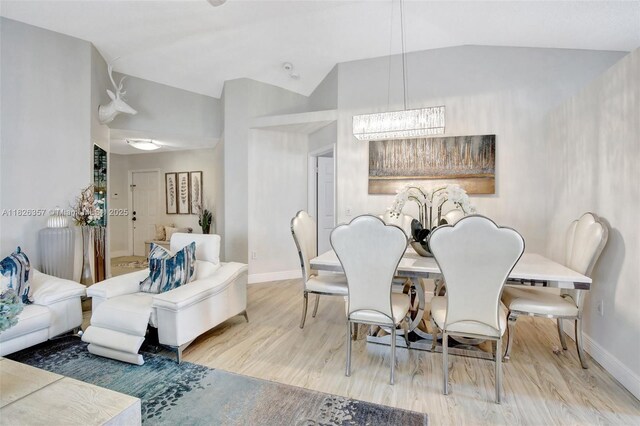 13552 NW 5th Ct, Plantation, FL 33325 - dining room with lofted ceiling, a chandelier, and wood finished floors