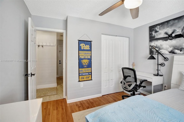 13552 NW 5th Ct, Plantation, FL 33325 - bedroom with wood finished floors, a closet, a ceiling fan, and a textured ceiling