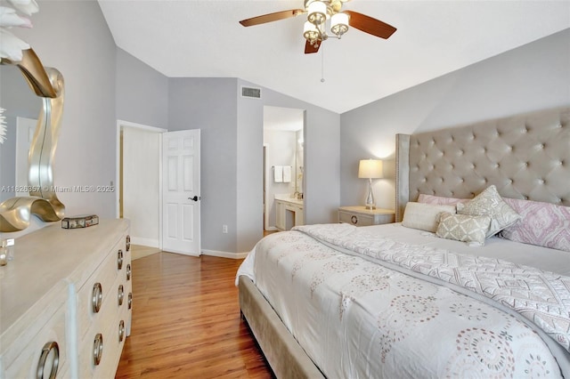 13552 NW 5th Ct, Plantation, FL 33325 - bedroom featuring light wood-style floors, vaulted ceiling, ensuite bathroom, and a ceiling fan