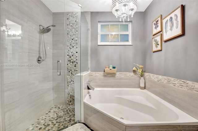 13552 NW 5th Ct, Plantation, FL 33325 - full bathroom with a shower stall, a garden tub, and a chandelier