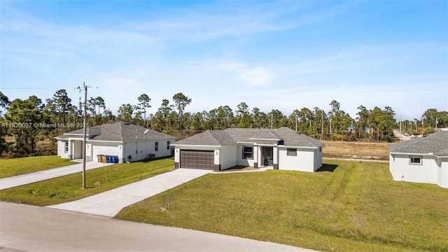 933 Gleason St, Lehigh Acres, FL 33974 - view of front of home featuring an attached garage, driveway, a front lawn, and stucco siding