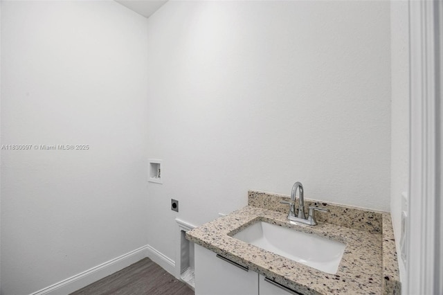 933 Gleason St, Lehigh Acres, FL 33974 - laundry room featuring electric dryer hookup, hookup for a washing machine, and wood finished floors