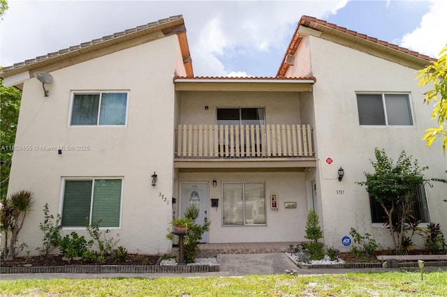 3719 Riverside Dr Unit 3719, Coral Springs, FL 33065 - rear view of property featuring a balcony and stucco siding