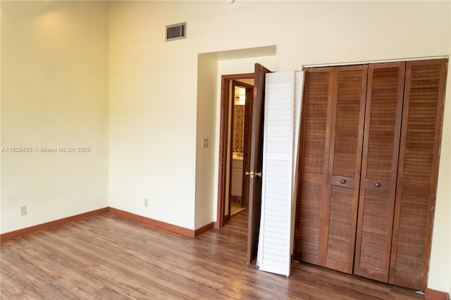 3719 Riverside Dr Unit 3719, Coral Springs, FL 33065 - unfurnished bedroom with wood finished floors and a closet
