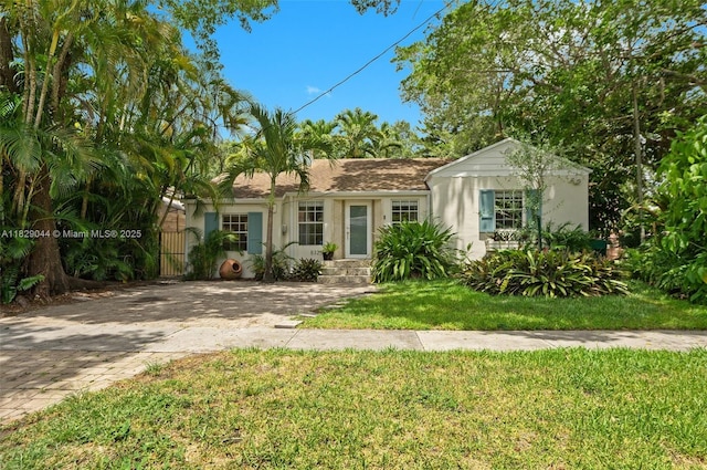 8325 NE 3rd Ave, Miami, FL 33138 - single story home featuring a front yard and stucco siding