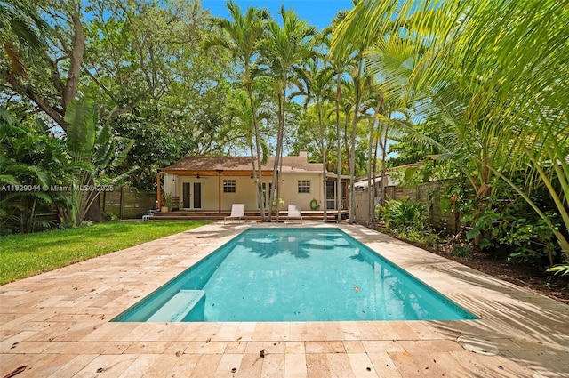 8325 NE 3rd Ave, Miami, FL 33138 - view of pool featuring a fenced backyard, a patio area, and french doors