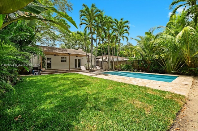 8325 NE 3rd Ave, Miami, FL 33138 - view of pool featuring a fenced backyard, french doors, a shed, and a patio