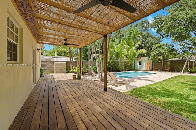 8325 NE 3rd Ave, Miami, FL 33138 - wooden deck with a ceiling fan, a storage unit, and a fenced backyard