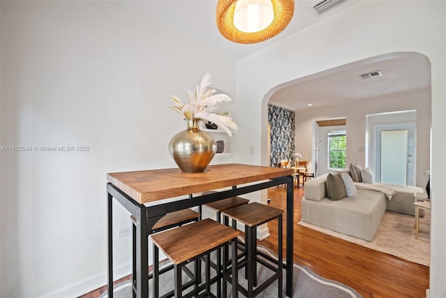 8325 NE 3rd Ave, Miami, FL 33138 - dining room with arched walkways and wood finished floors
