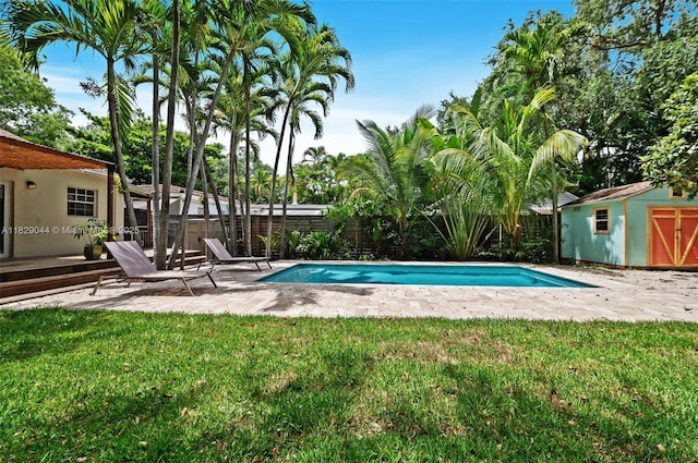 8325 NE 3rd Ave, Miami, FL 33138 - view of pool featuring a fenced backyard, a patio area, and a storage unit