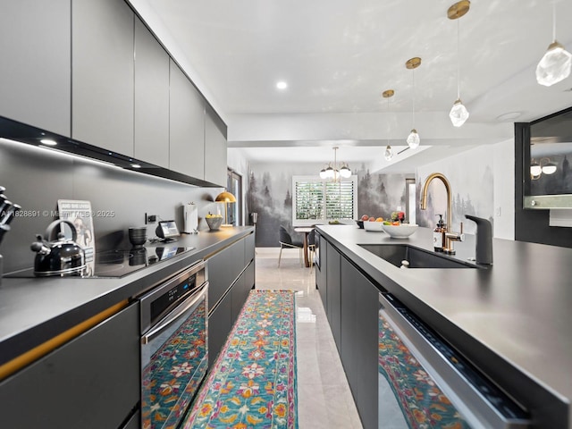 1117 Alberca St, Coral Gables, FL 33134 - kitchen featuring stainless steel oven, dishwashing machine, pendant lighting, black electric stovetop, and a chandelier