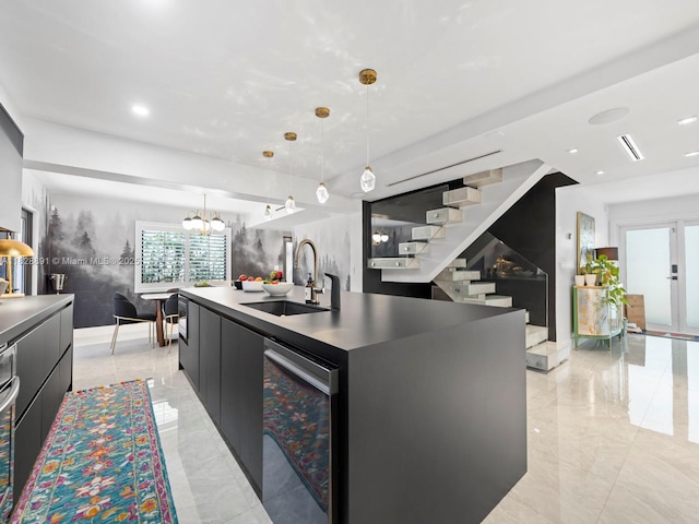 1117 Alberca St, Coral Gables, FL 33134 - kitchen with modern cabinets, a center island with sink, hanging light fixtures, dark cabinetry, and recessed lighting