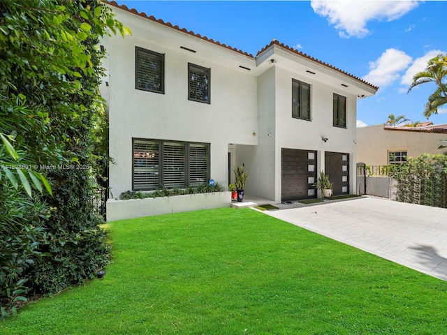 1117 Alberca St, Coral Gables, FL 33134 - view of front facade with stucco siding, a garage, decorative driveway, and a tiled roof