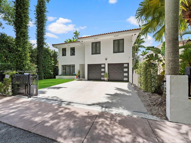 1117 Alberca St, Coral Gables, FL 33134 - mediterranean / spanish-style home featuring stucco siding, a garage, driveway, a tiled roof, and stone siding