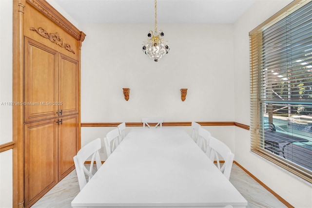 6201 Floridian Cir, Lake Worth, FL 33463 - dining area with light marble finish flooring and a chandelier