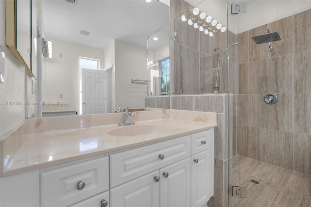 6201 Floridian Cir, Lake Worth, FL 33463 - bathroom with a shower stall, vanity, and a chandelier