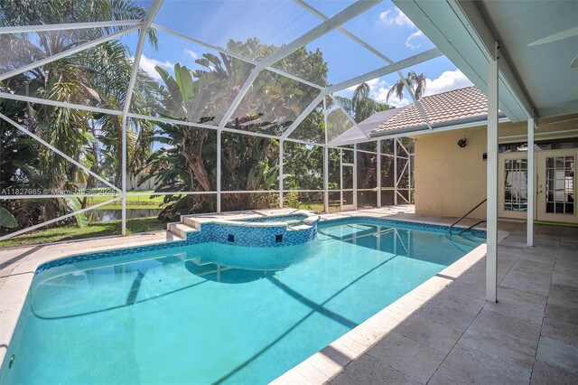 6201 Floridian Cir, Lake Worth, FL 33463 - view of pool featuring a lanai, a pool with connected hot tub, and a patio area