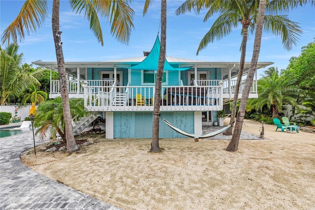 835 70th St, Gulf, Marathon, FL 33050 - back of property with a metal roof and stairway