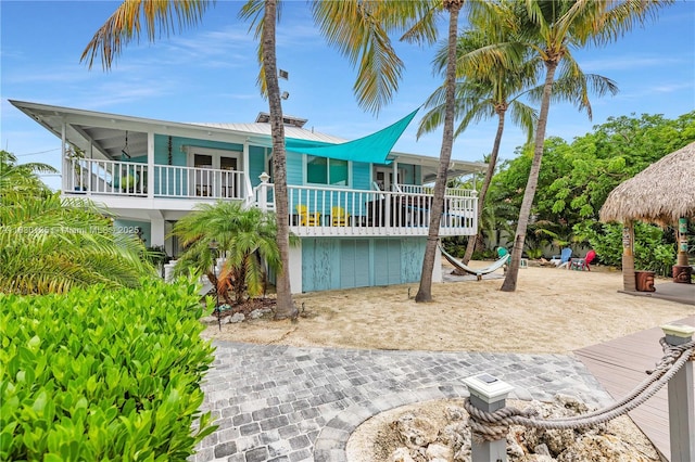 835 70th St, Gulf, Marathon, FL 33050 - back of property with a balcony and a metal roof