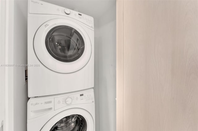 88 SW 7th St Unit 2107, Miami, FL 33130 - laundry area with stacked washer / dryer