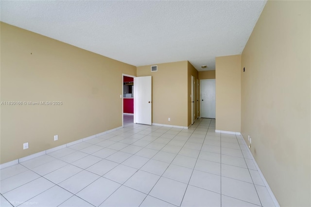 3725 S Ocean Dr Unit 1411, Hollywood, FL 33019 - unfurnished room with a textured ceiling and light tile patterned floors